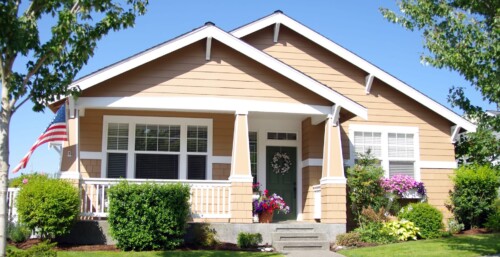 Front of Single Family Home with American Flag on the Front Porch